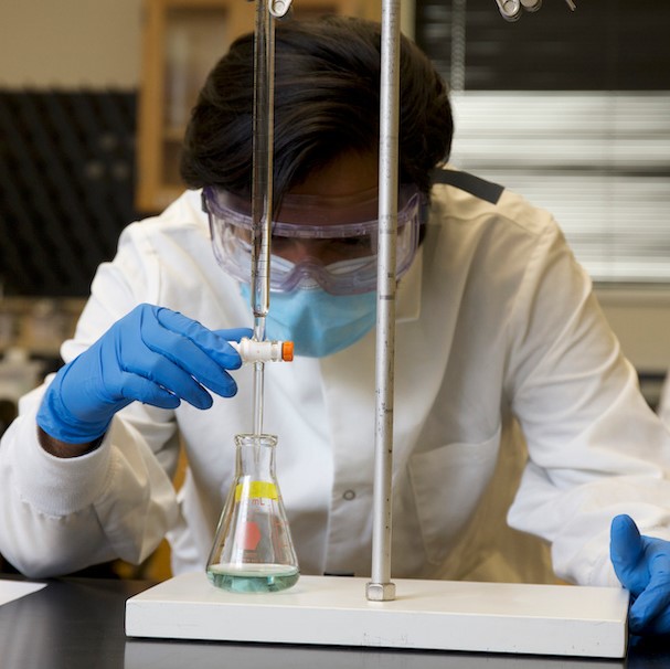 Biology student in a chemistry lab